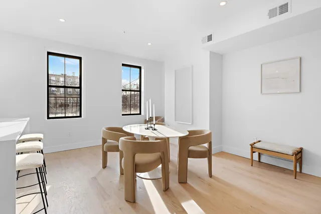 a view of a room with furniture and window