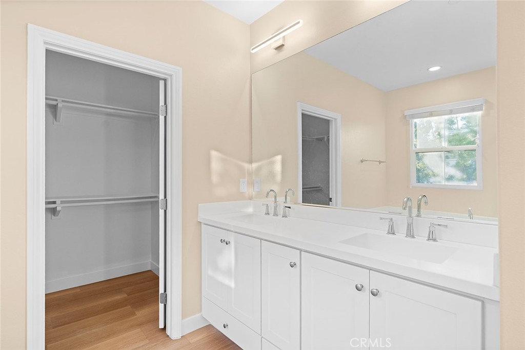 143 Rodeo Irvine, CA 92602 - Photo 22 of 37 a bathroom with a sink double vanity and a mirror