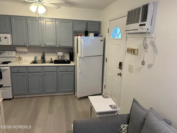 a kitchen with a sink cabinets and stainless steel appliances