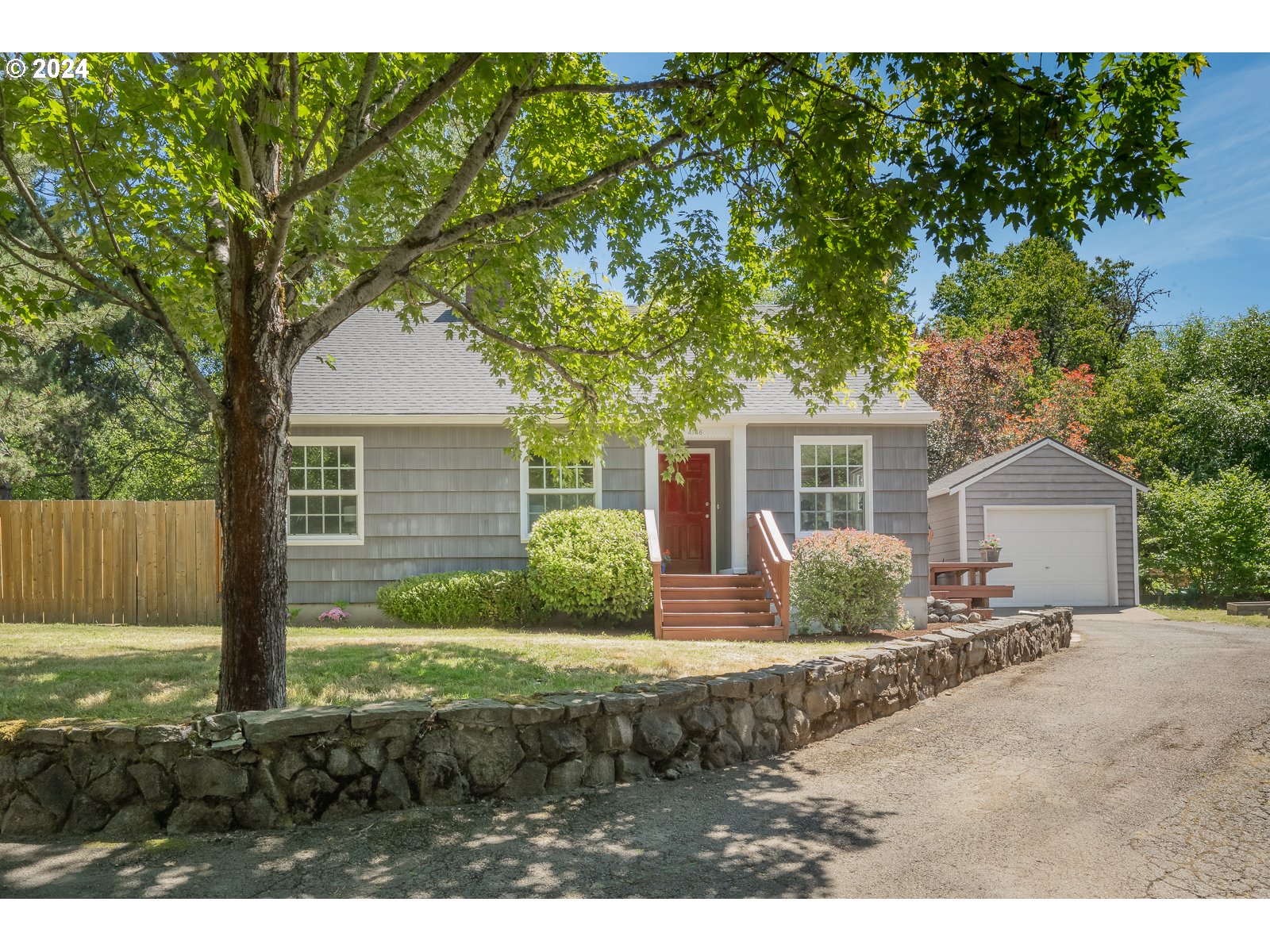 4146 Southwest Hamilton Street Portland, OR 97221 - Photo 1 of 43 a front view of a house with a garden and yard