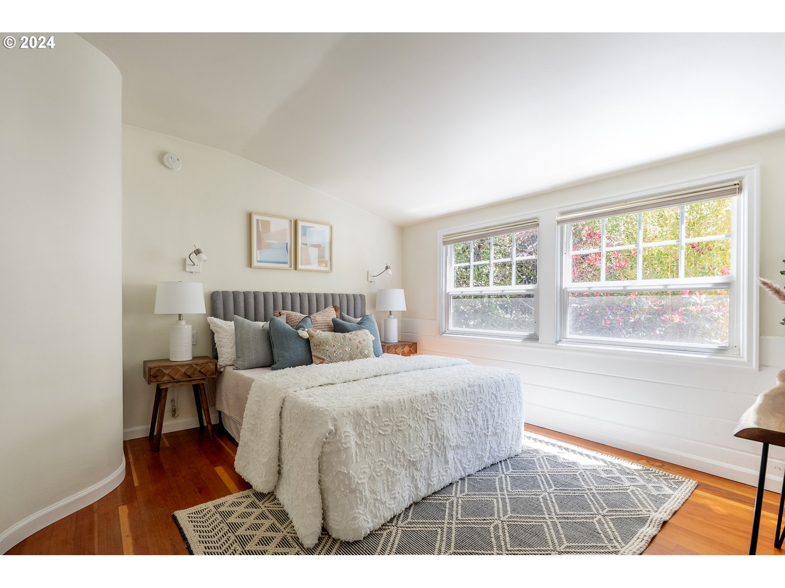 4146 Southwest Hamilton Street Portland, OR 97221 - Photo 25 of 43 a bedroom with a bed and a large window