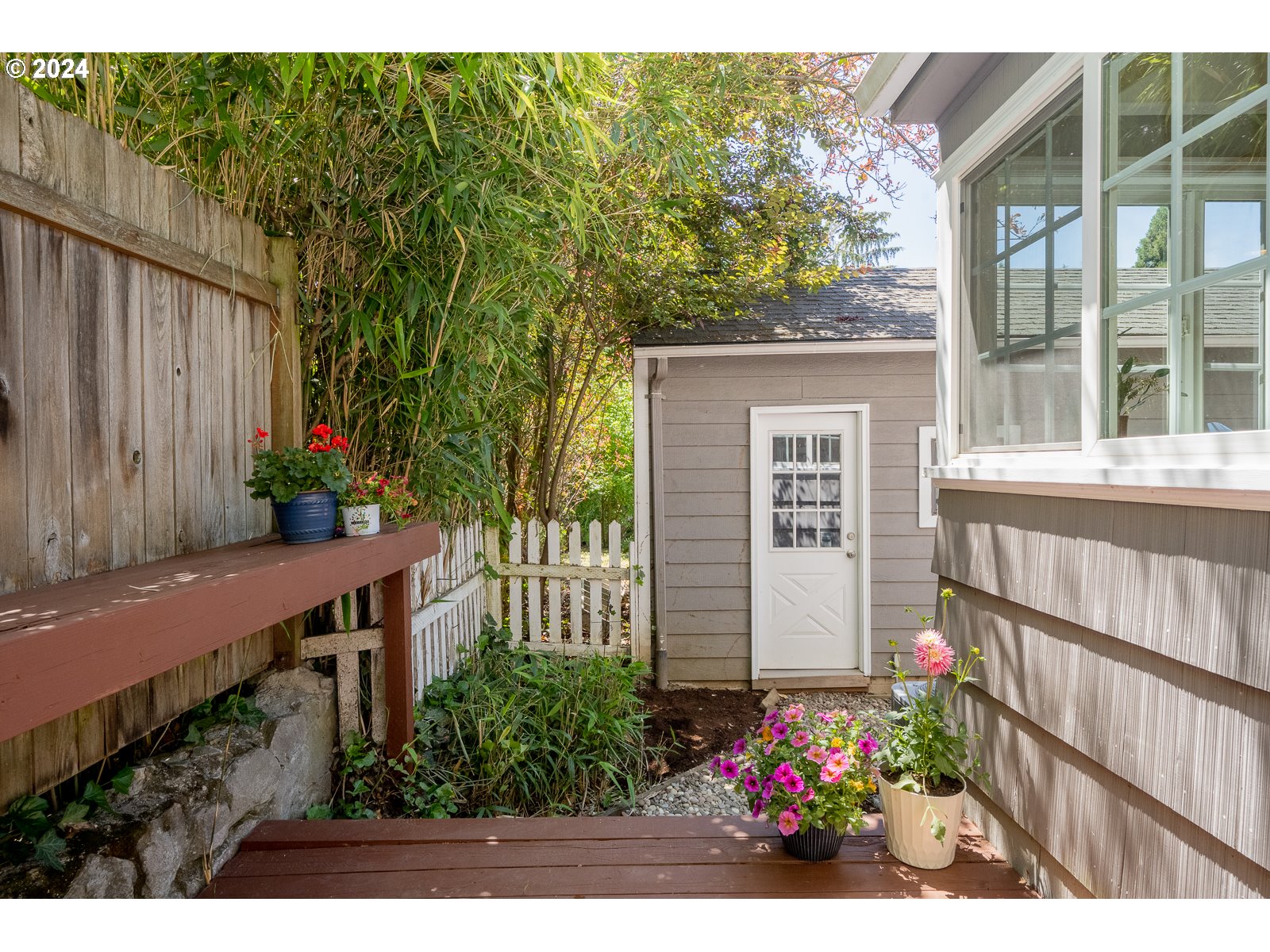 4146 Southwest Hamilton Street Portland, OR 97221 - Photo 35 of 43 a view of a house with a flower garden
