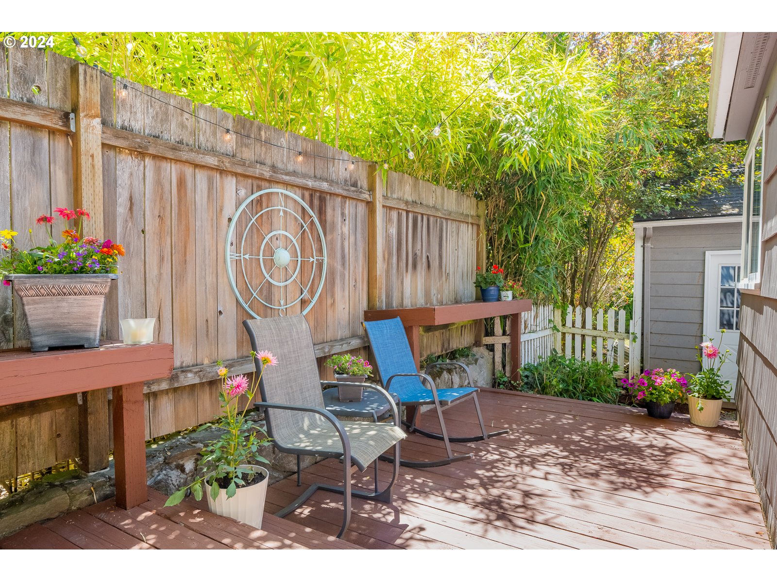 4146 Southwest Hamilton Street Portland, OR 97221 - Photo 36 of 43 a backyard of a house with outdoor seating