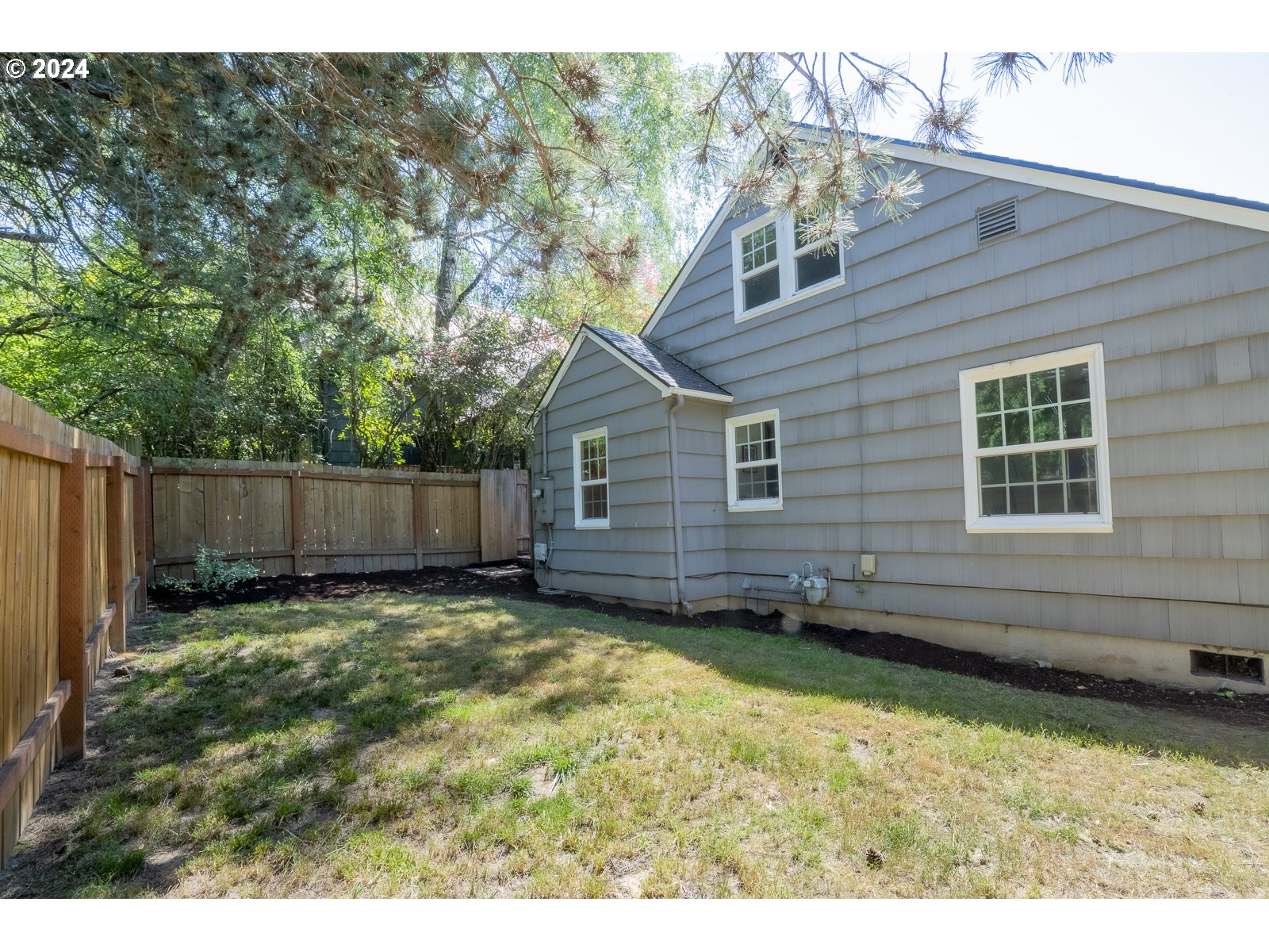 4146 Southwest Hamilton Street Portland, OR 97221 - Photo 41 of 43 a view of a backyard with a large tree