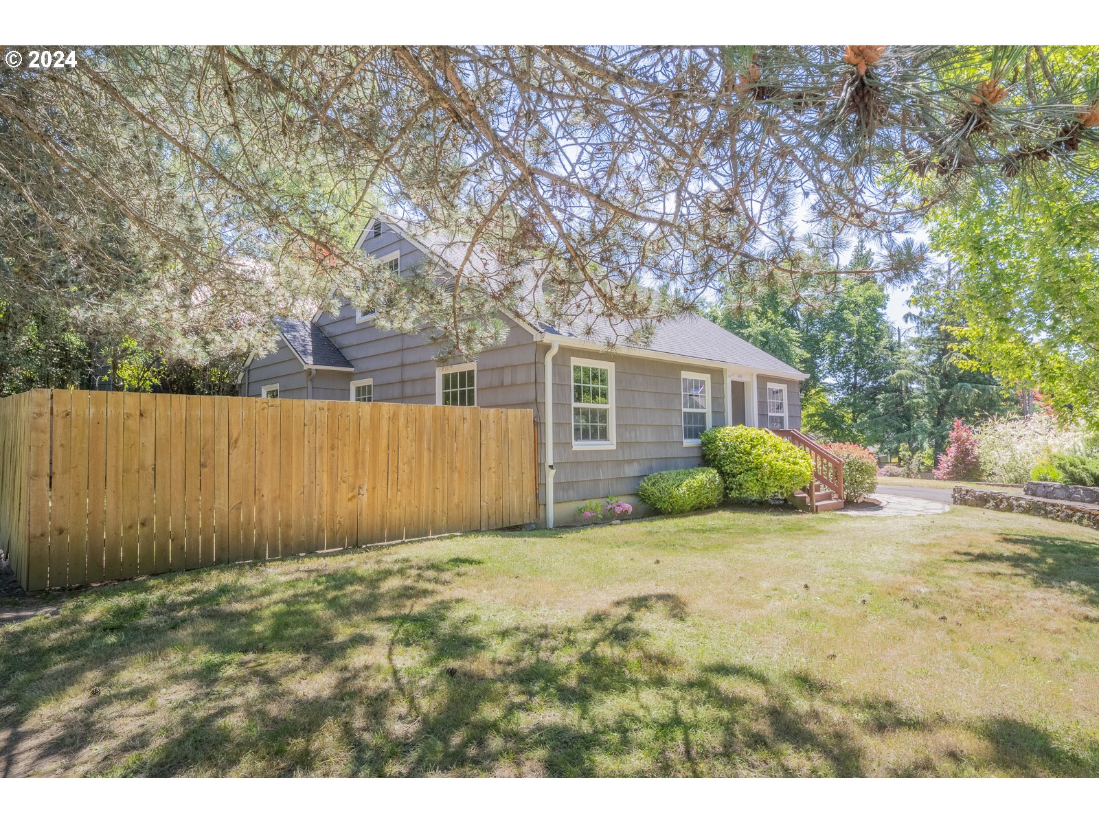 4146 Southwest Hamilton Street Portland, OR 97221 - Photo 42 of 43 a view of a house with a house in the background