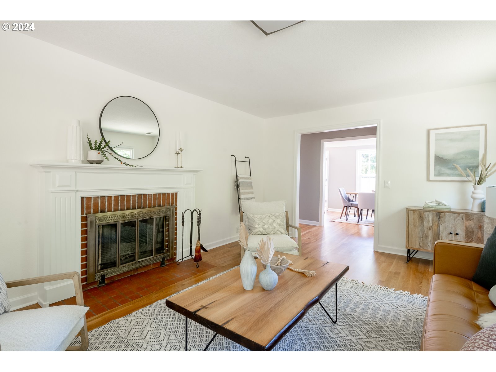 4146 Southwest Hamilton Street Portland, OR 97221 - Photo 6 of 43 a living room with furniture a fireplace and wooden floor