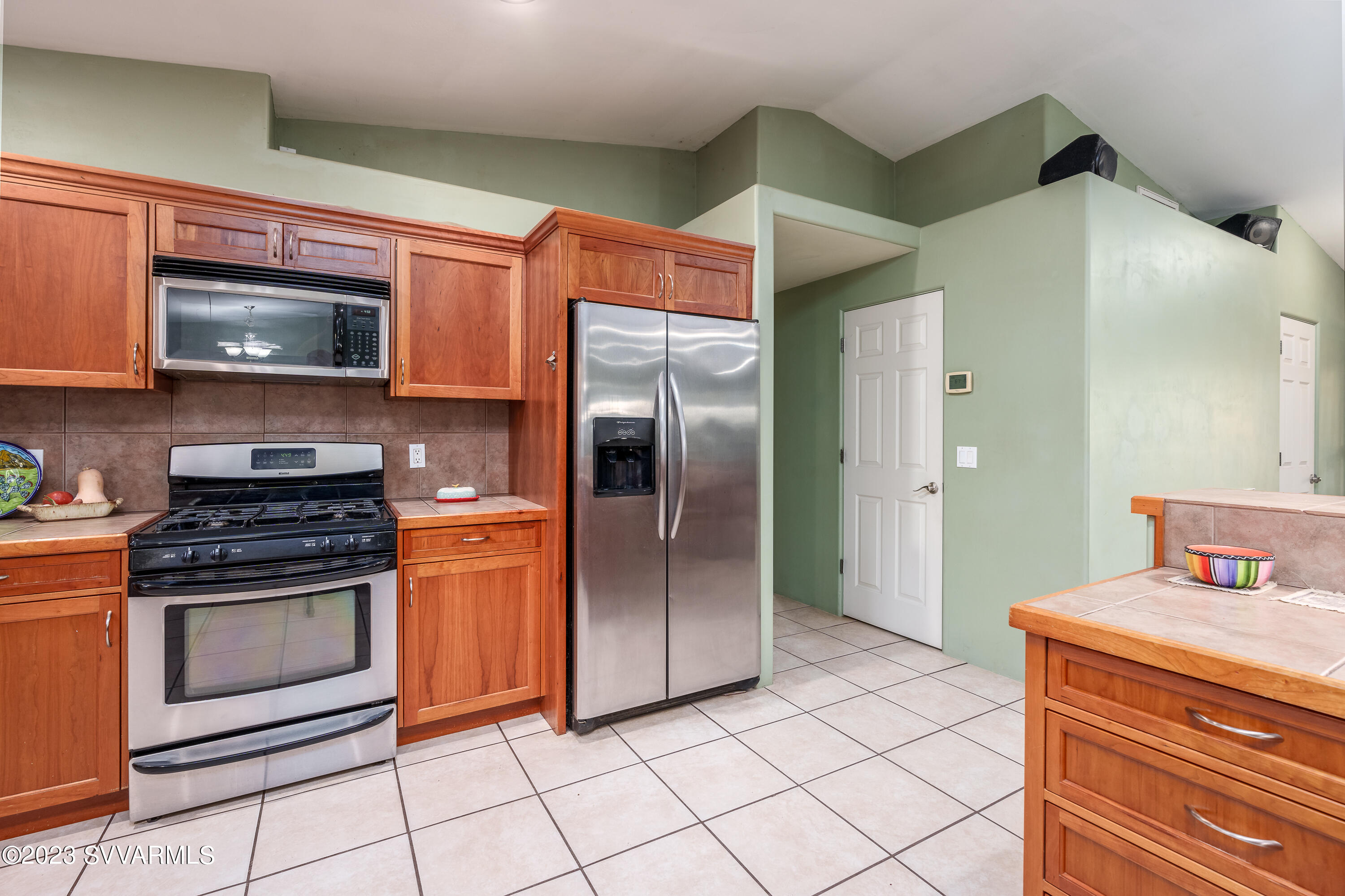 1055 Reay Road Rimrock, AZ 86335 - Photo 13 of 34 a kitchen with stainless steel appliances granite countertop a refrigerator and a stove top oven