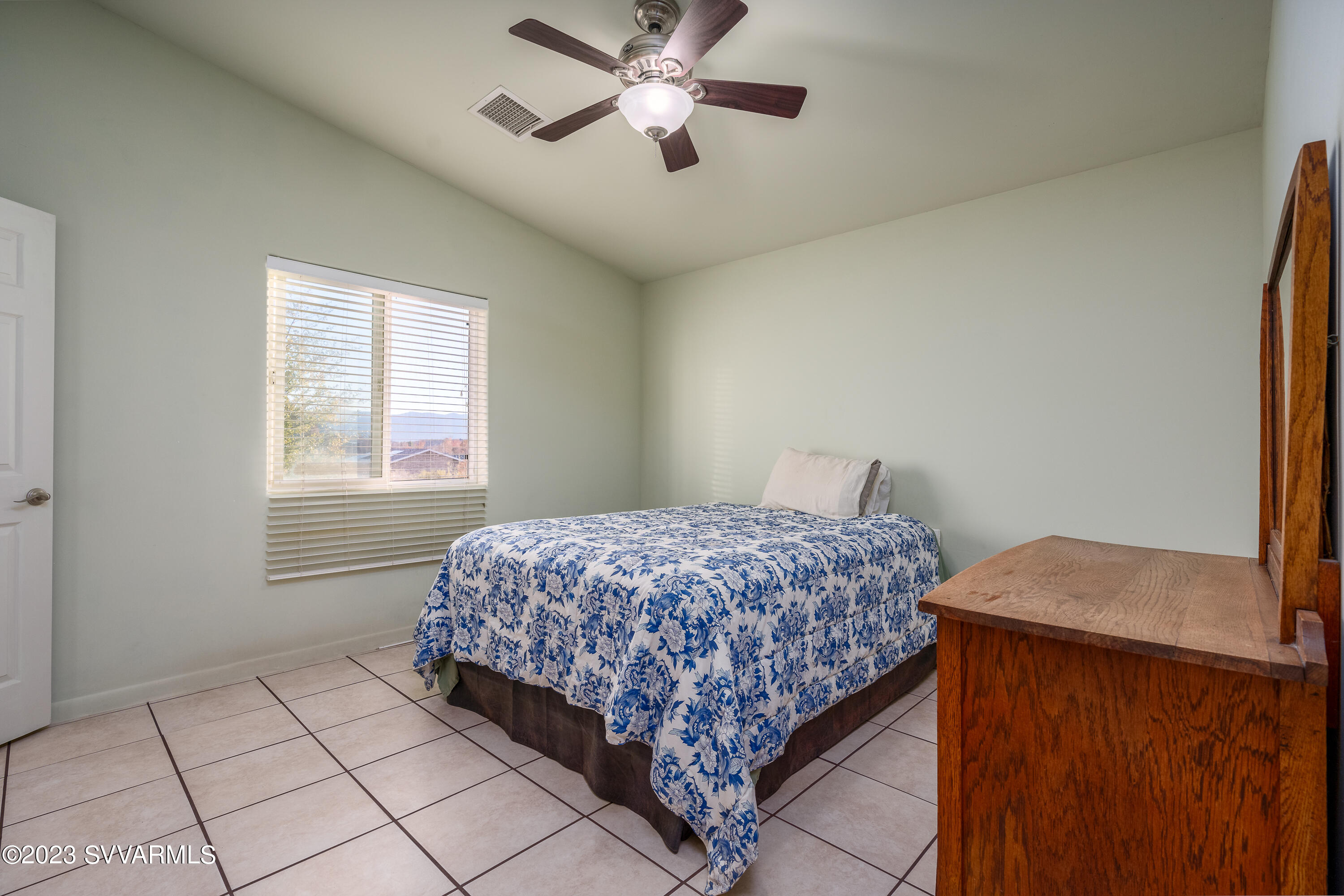 1055 Reay Road Rimrock, AZ 86335 - Photo 20 of 34 a bedroom with a bed and a window