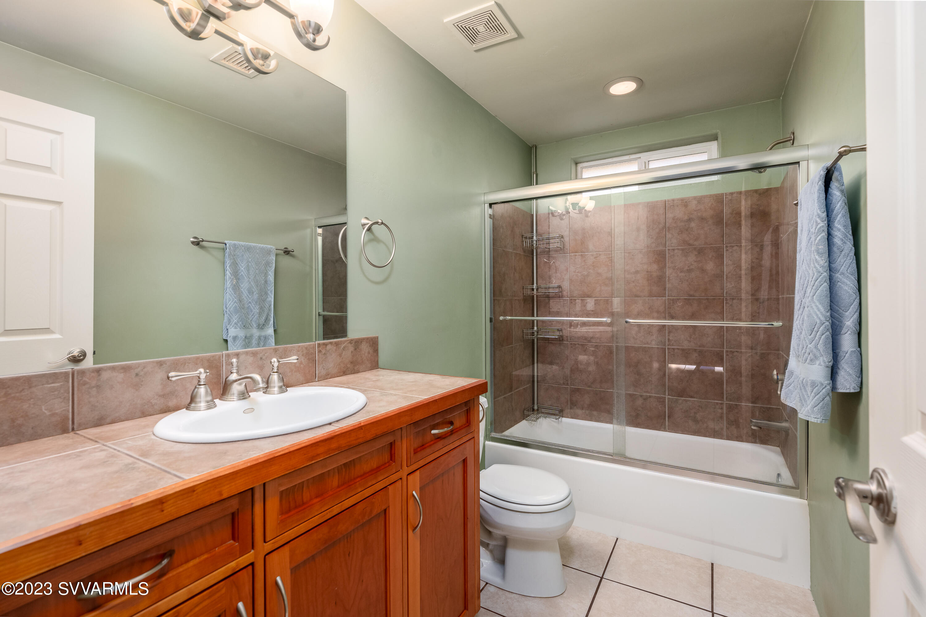 1055 Reay Road Rimrock, AZ 86335 - Photo 21 of 34 a bathroom with a sink a toilet and shower