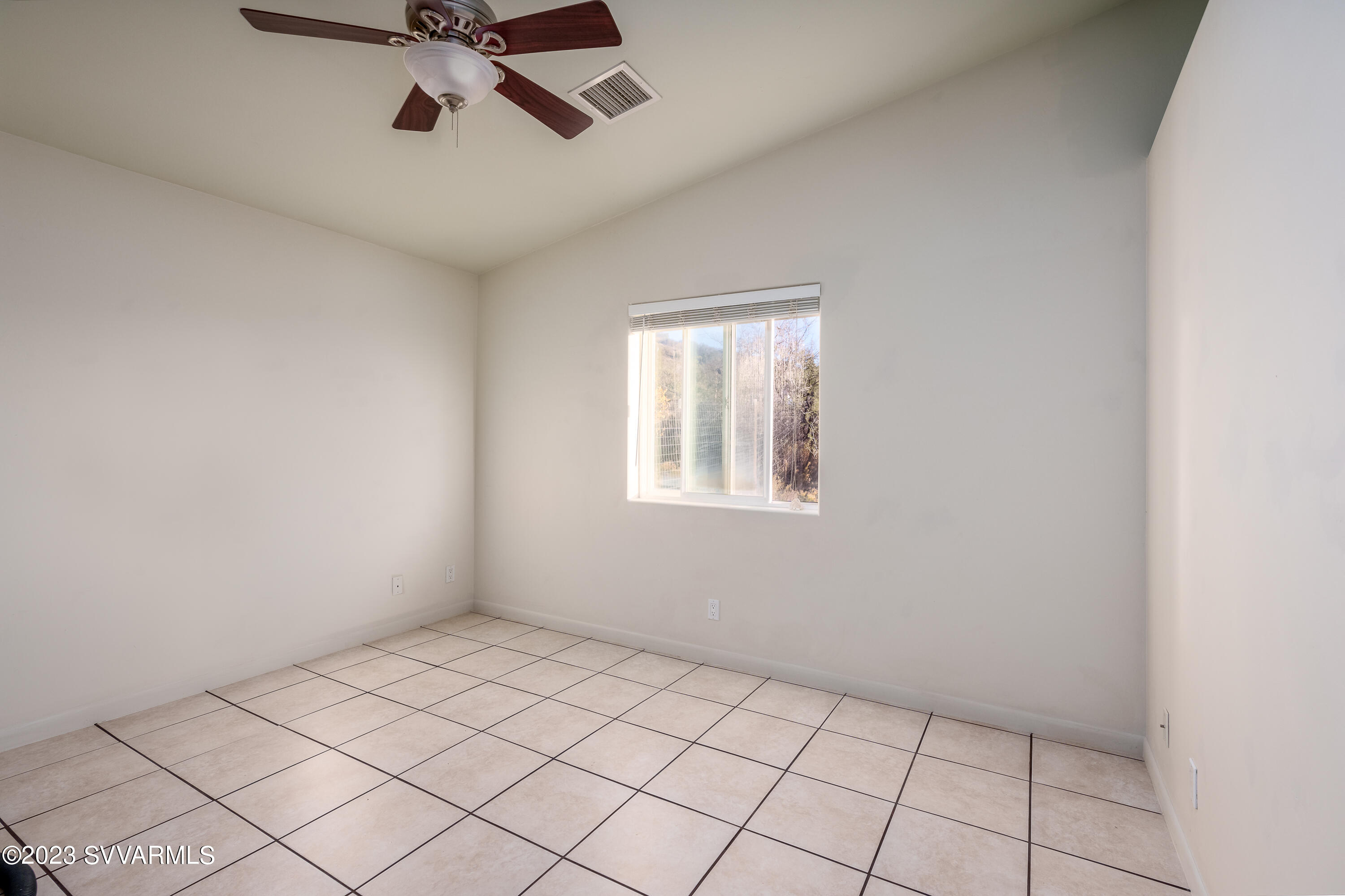 1055 Reay Road Rimrock, AZ 86335 - Photo 23 of 34 a view of an empty room and a window