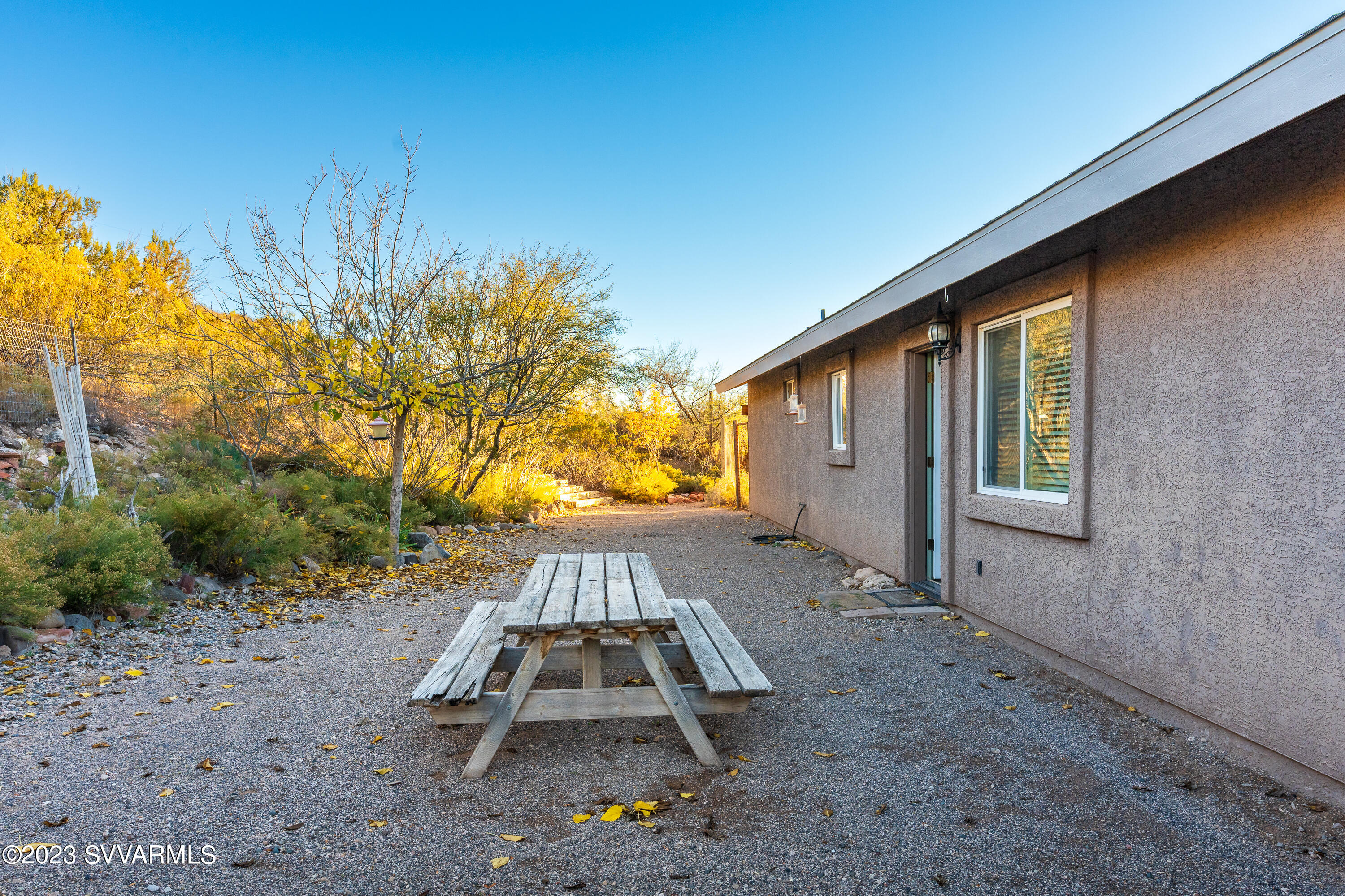 1055 Reay Road Rimrock, AZ 86335 - Photo 31 of 34 a view of a backyard with wooden fence and floor