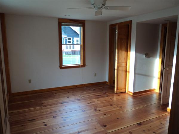 806 County Road Wareham, MA 02576 - Photo 8 of 19 an empty room with wooden floor and windows