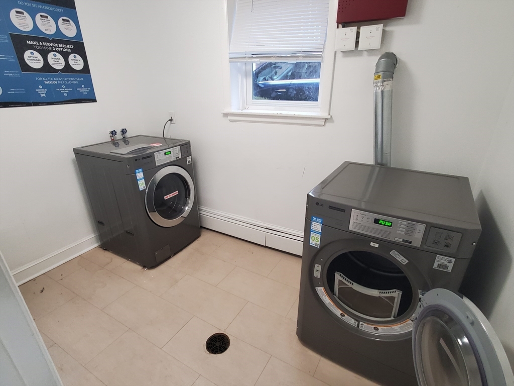 433 B Sea Street, Unit 5 Quincy, MA 02169 - Photo 14 of 14 a utility room with dryer and washer