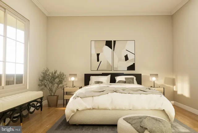 a bedroom with a large bed and a window