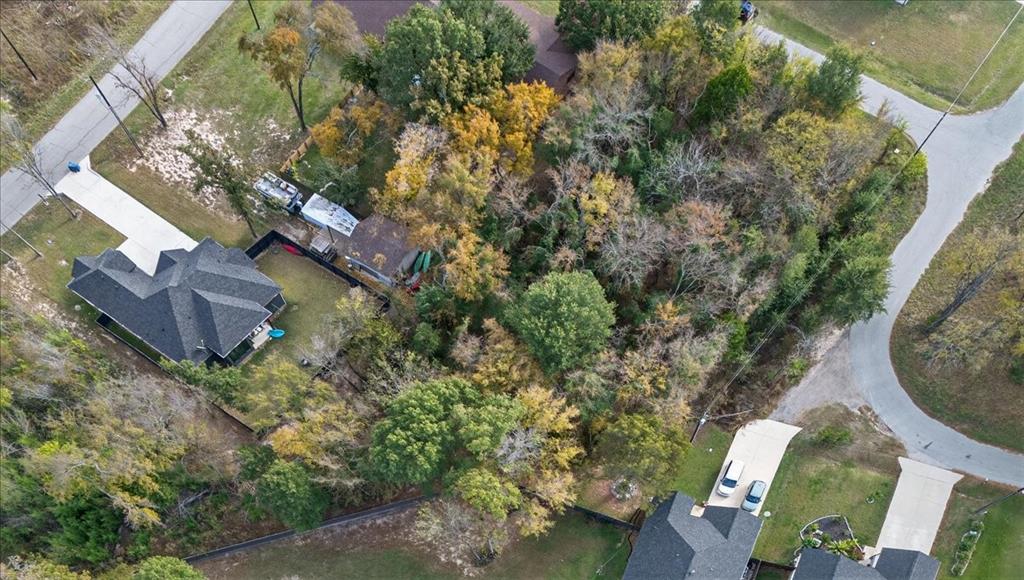 721 Oahu Loop Tool, TX 75143 - Photo 6 of 12 an aerial view of a house with a yard basket ball court and outdoor seating