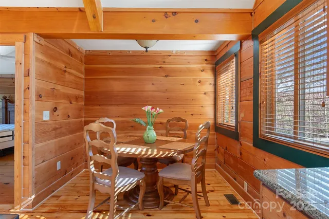 a balcony with table and chairs