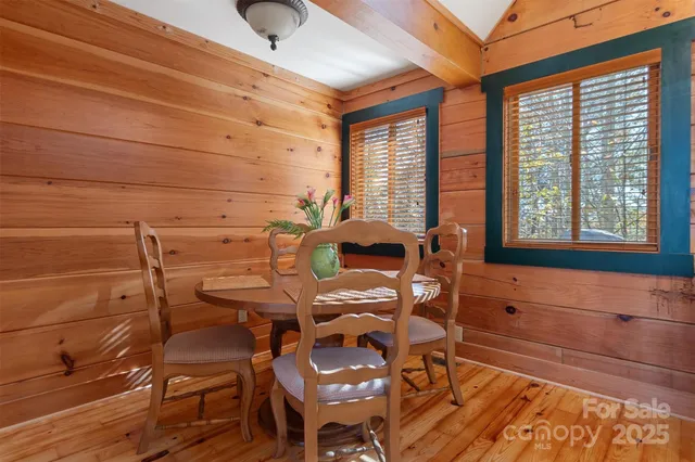a view of a dining room with furniture and window