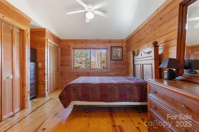 a living room with a bed furniture and a window