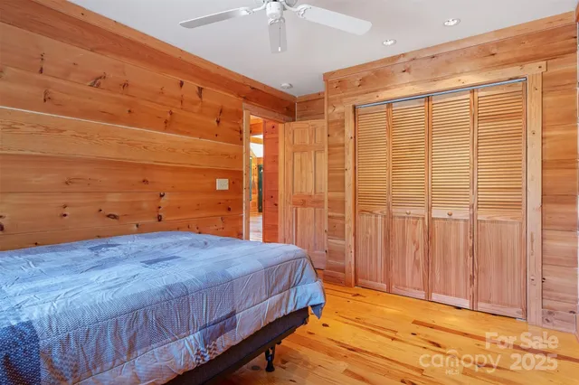 a bedroom with a bed and a table