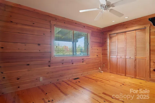 a view of an entryway with a chandelier fan