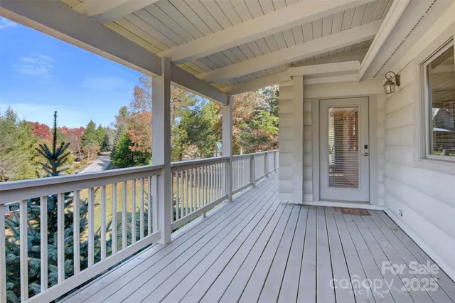 a view of a balcony with wooden floor