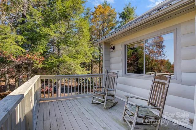 a view of a two chairs in the balcony
