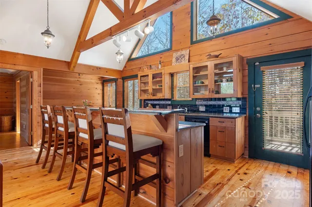 a view of a patio with dining table and chairs