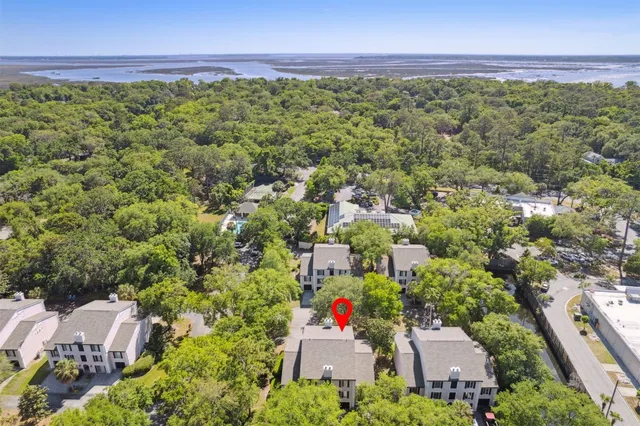 a view of a swimming pool with a patio and a yard