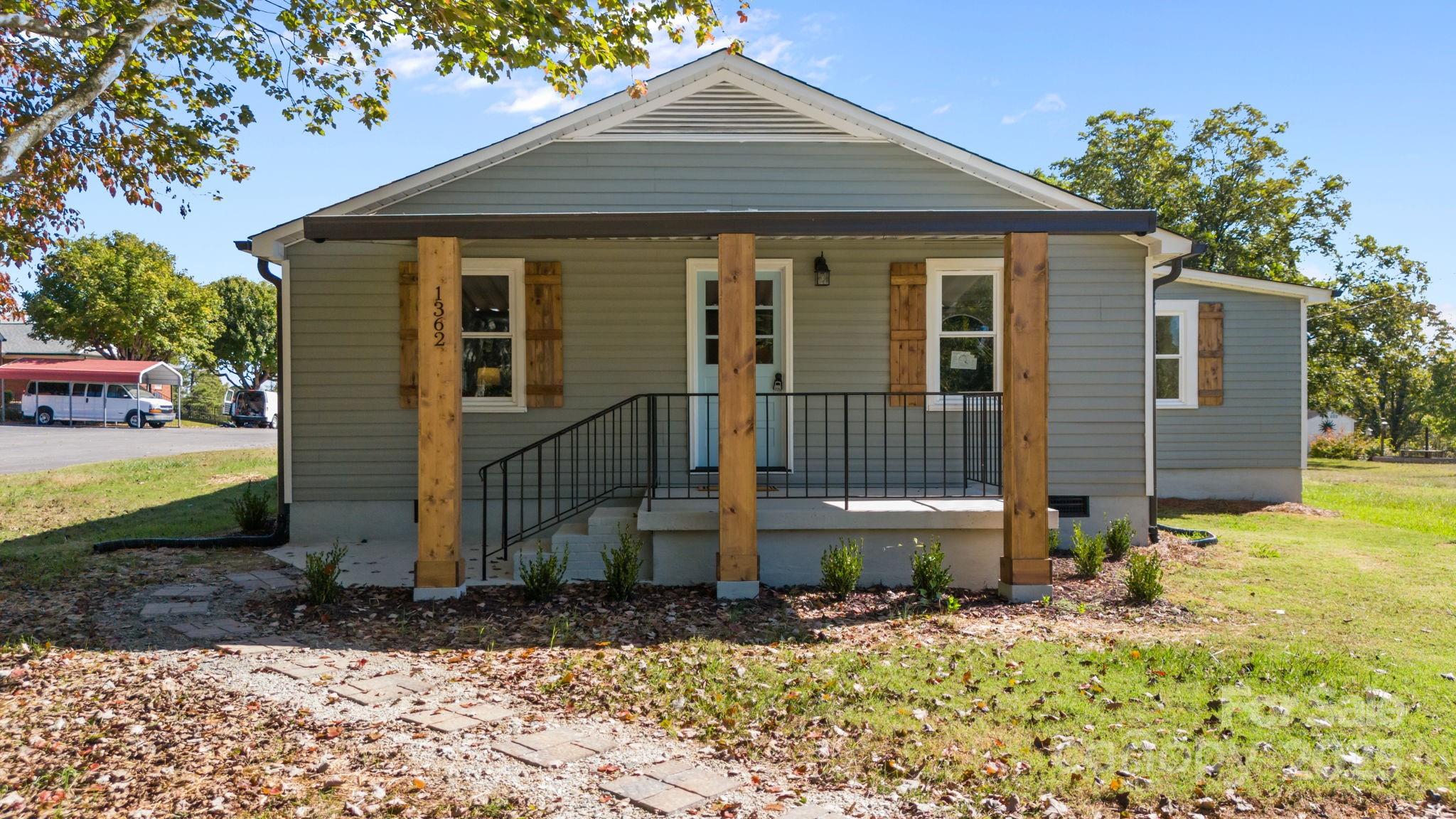 1362 Cornatzer Road Mocksville, NC 27028 - Photo 1 of 48 a front view of a house with garden