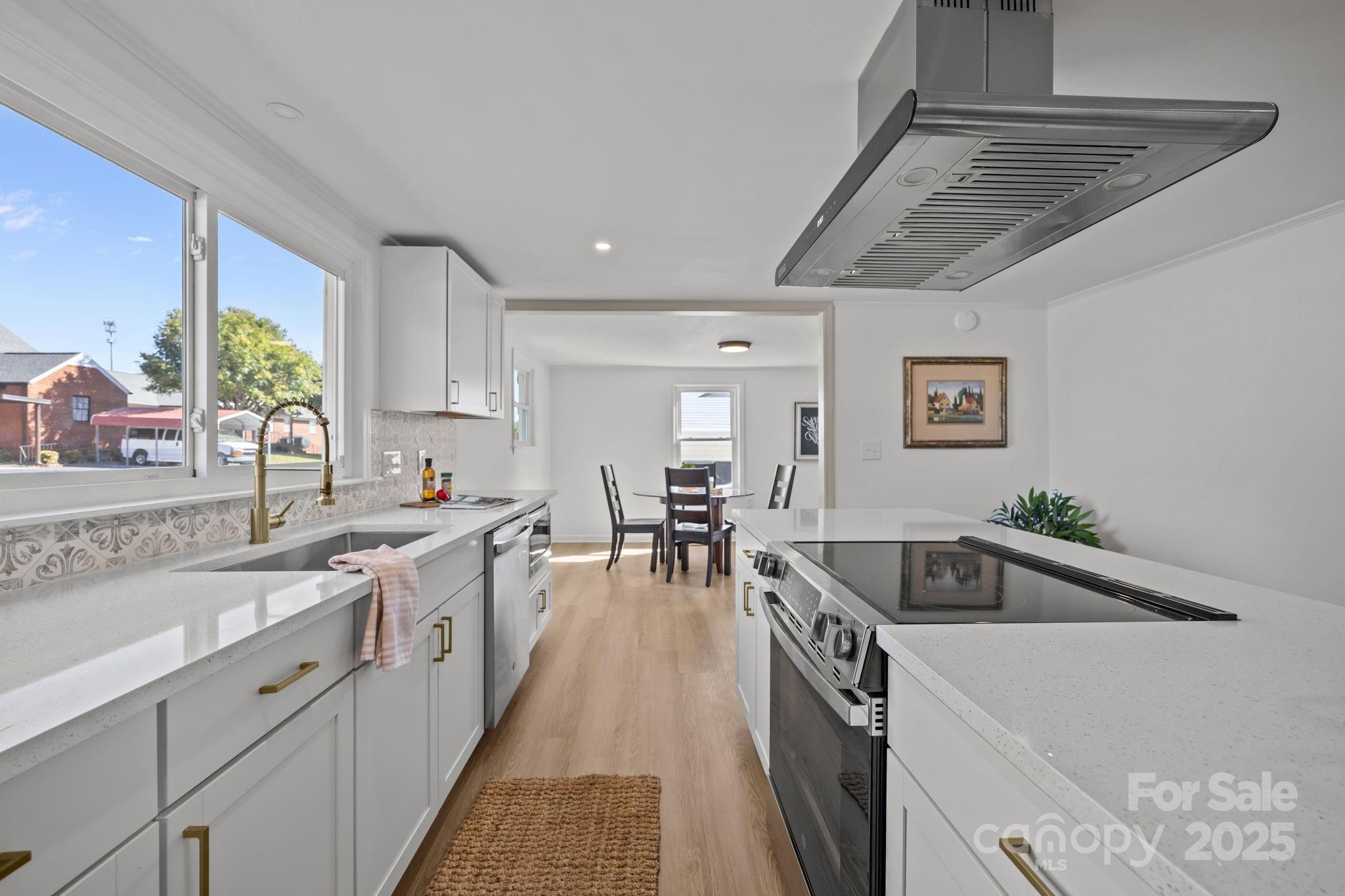 1362 Cornatzer Road Mocksville, NC 27028 - Photo 12 of 48 a kitchen with counter top space sink and stainless steel appliances