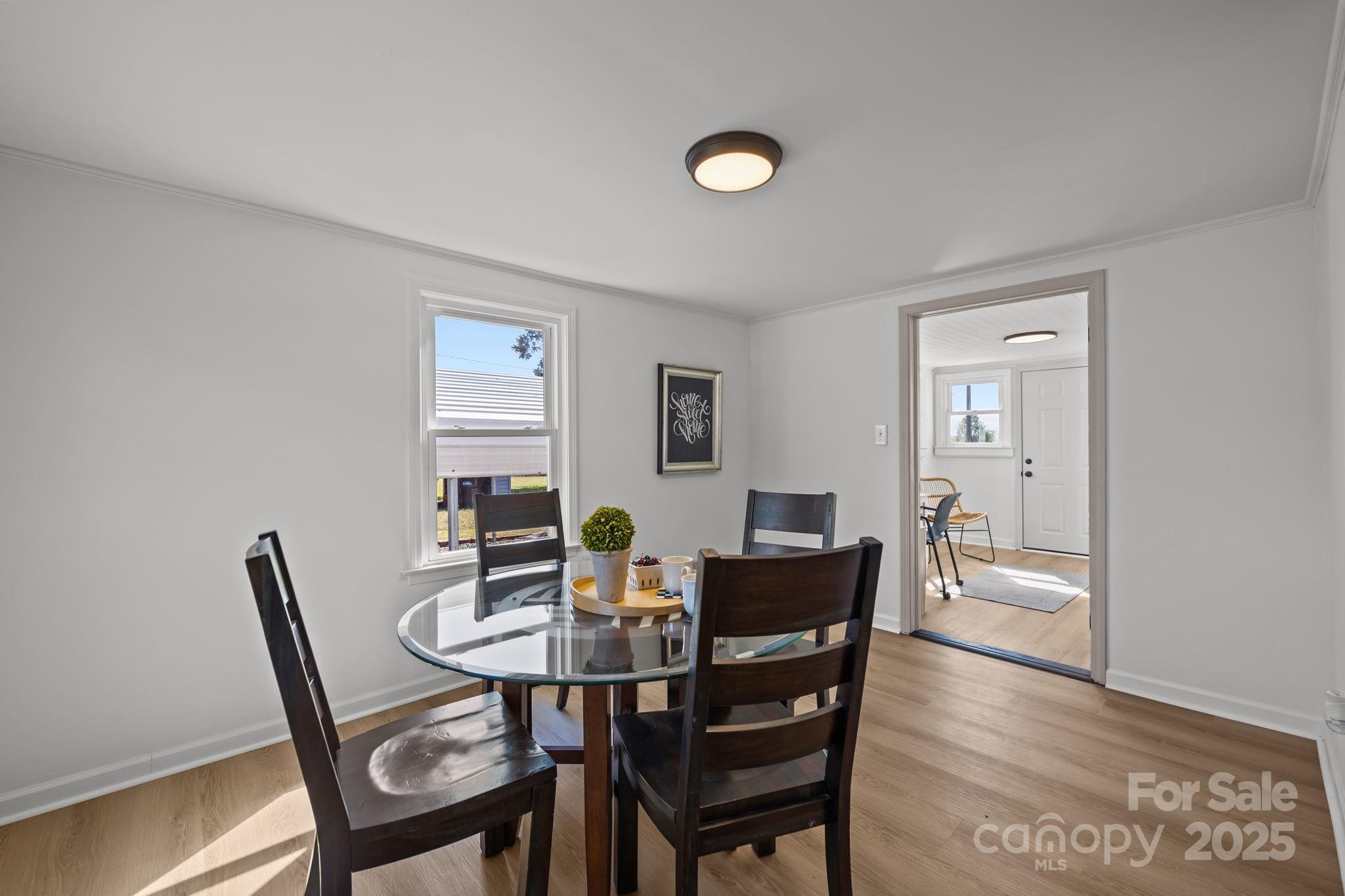 1362 Cornatzer Road Mocksville, NC 27028 - Photo 14 of 48 a view of a dining room with furniture and wooden floor
