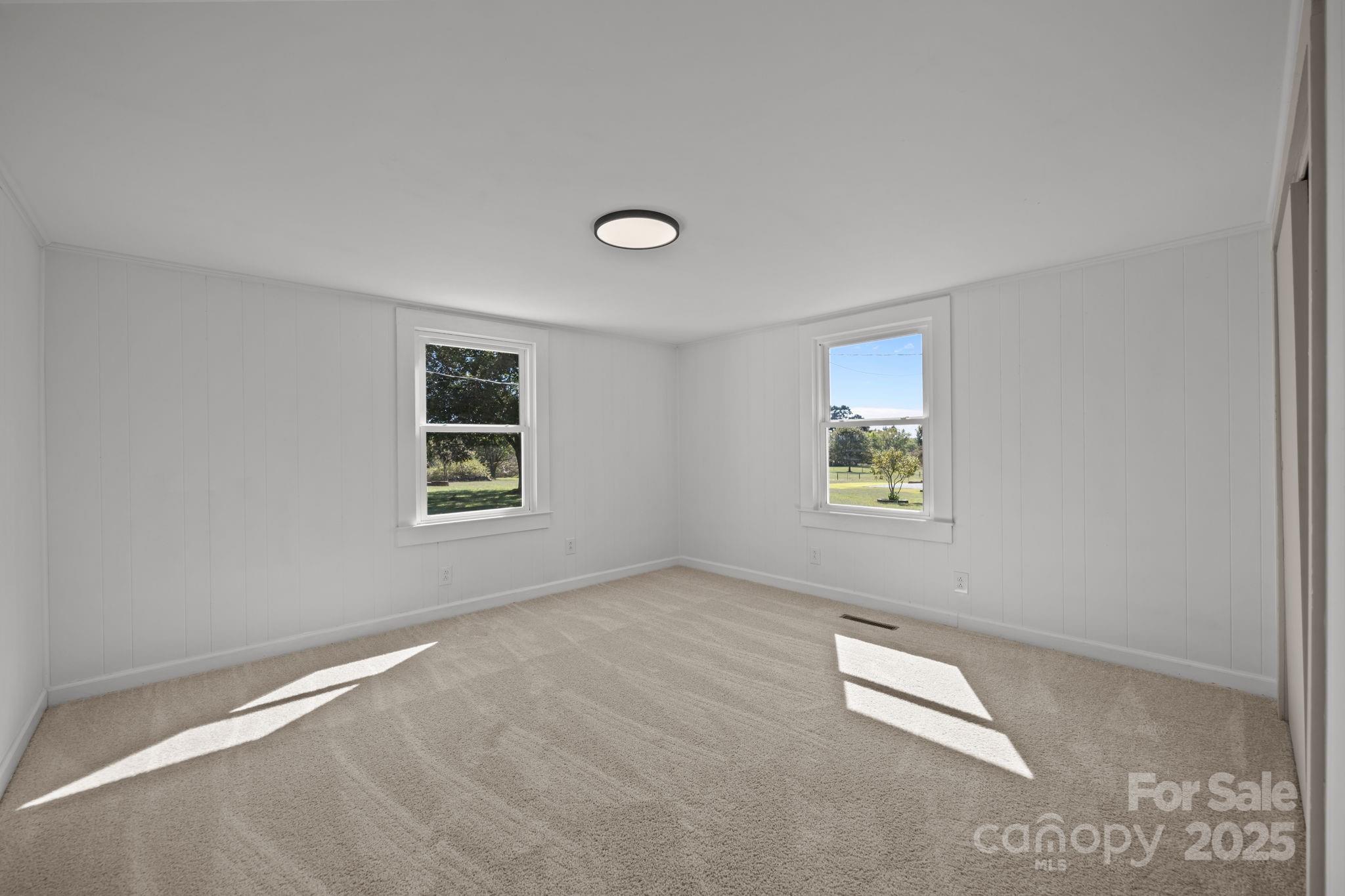 1362 Cornatzer Road Mocksville, NC 27028 - Photo 23 of 48 an empty room with windows