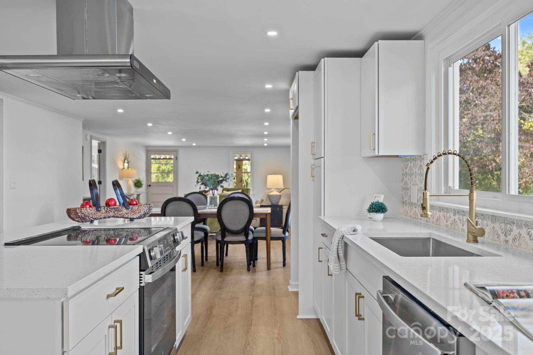 1362 Cornatzer Road Mocksville, NC 27028 - Photo 3 of 48 a kitchen that has a lot of cabinets a sink and appliances in it