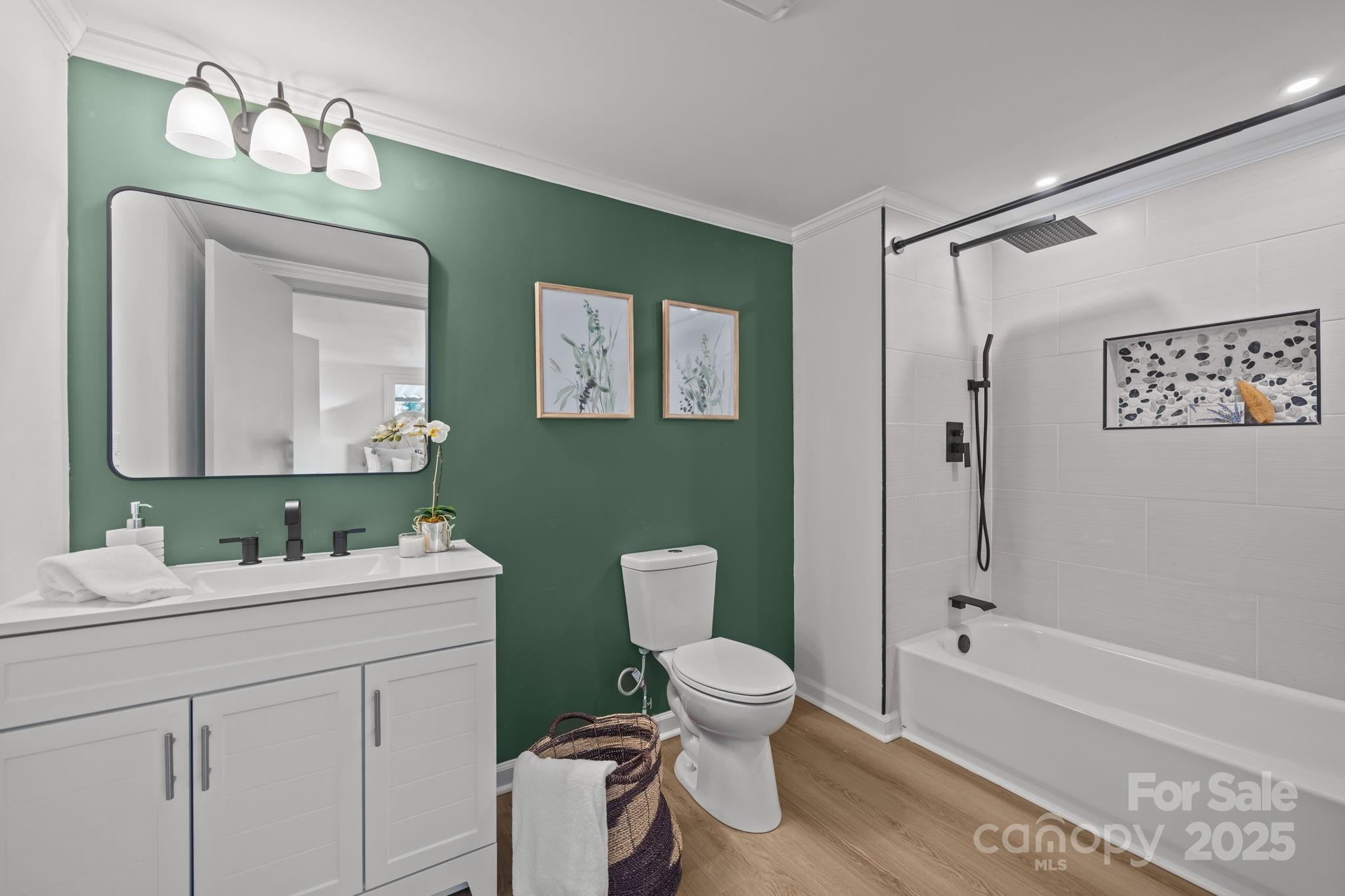 1362 Cornatzer Road Mocksville, NC 27028 - Photo 31 of 48 a bathroom with a toilet sink and mirror