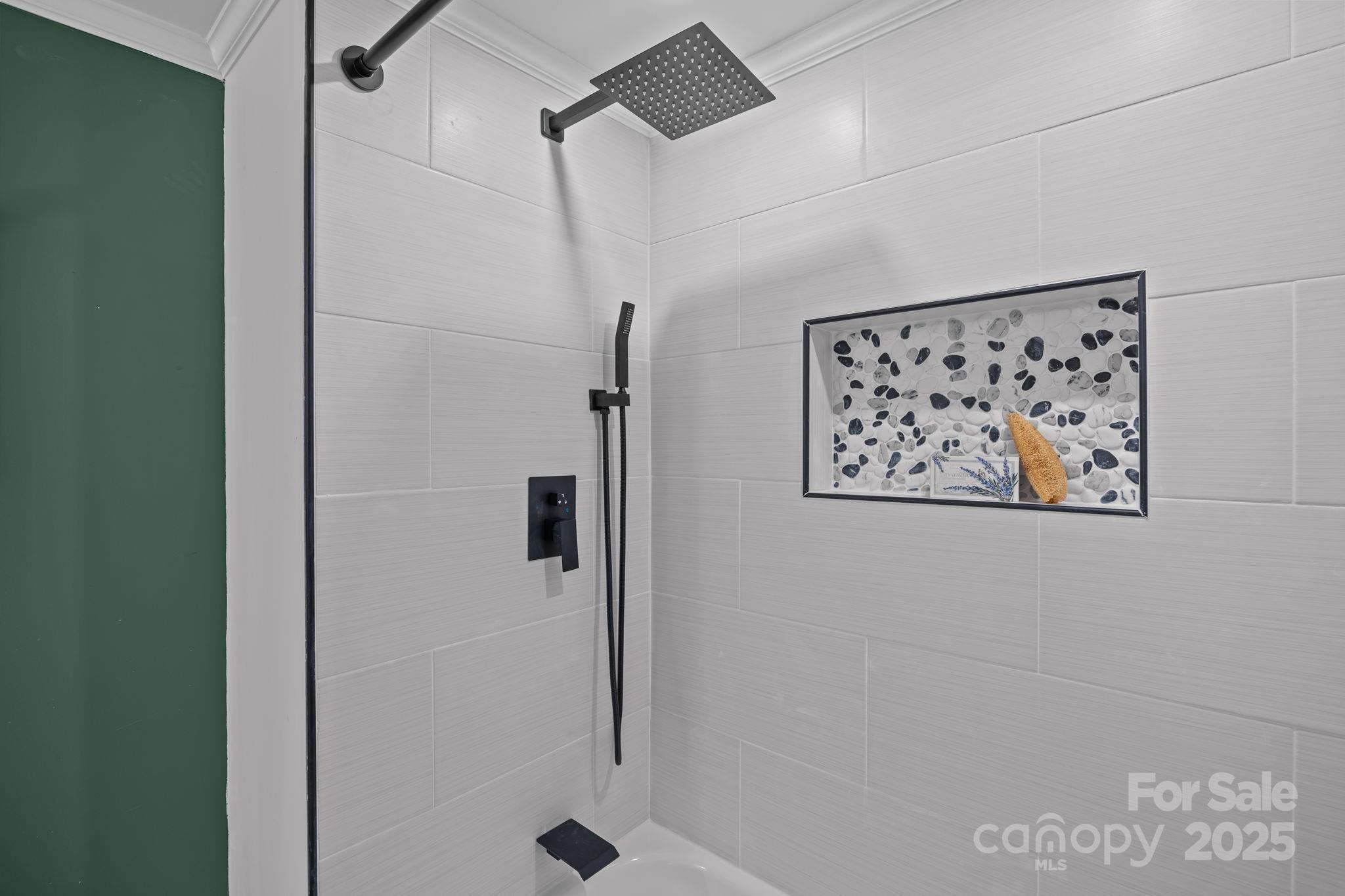 1362 Cornatzer Road Mocksville, NC 27028 - Photo 32 of 48 a bathroom with a shower and a view of a bathroom