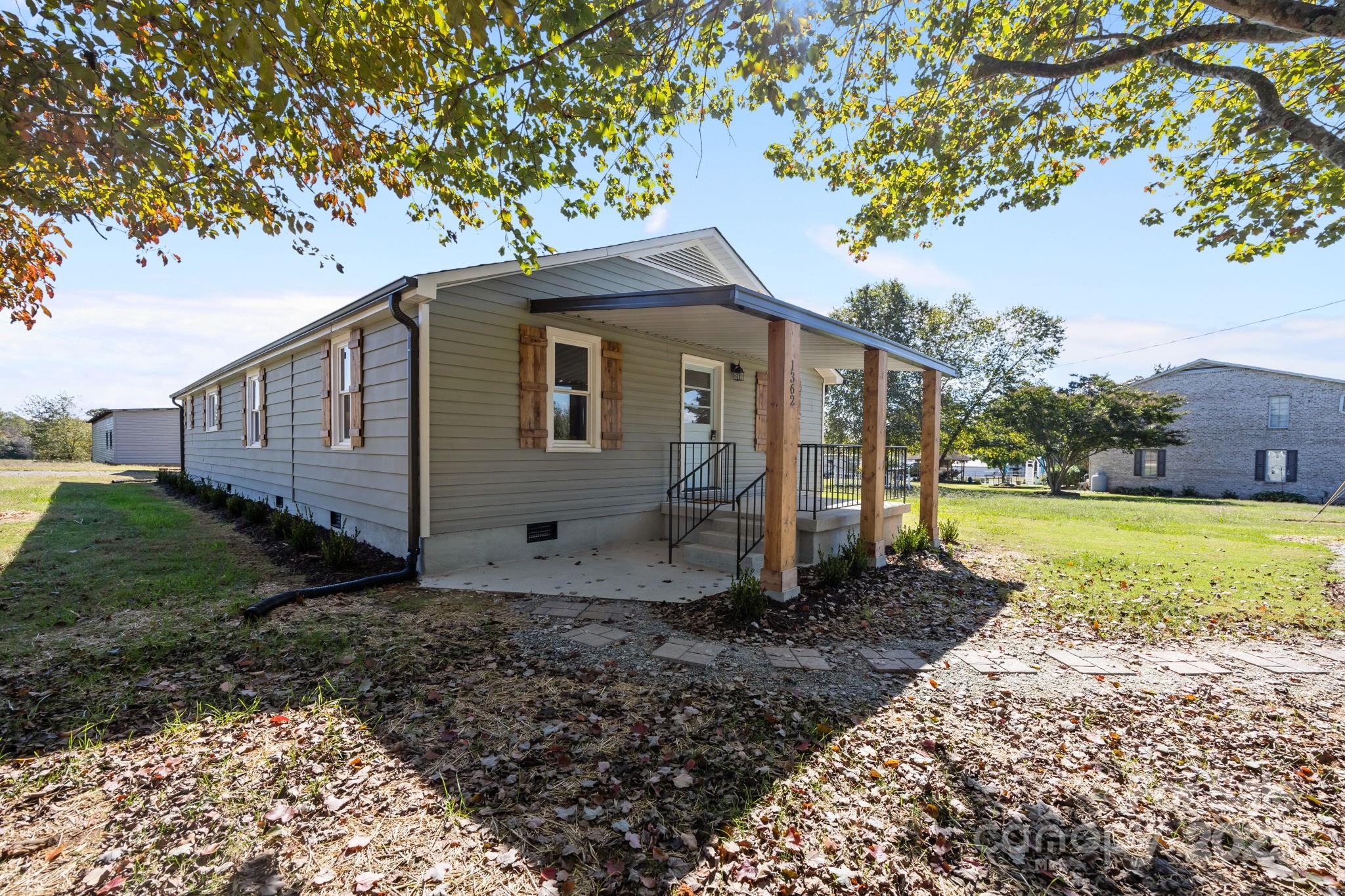 1362 Cornatzer Road Mocksville, NC 27028 - Photo 36 of 48 a view of a house with a yard