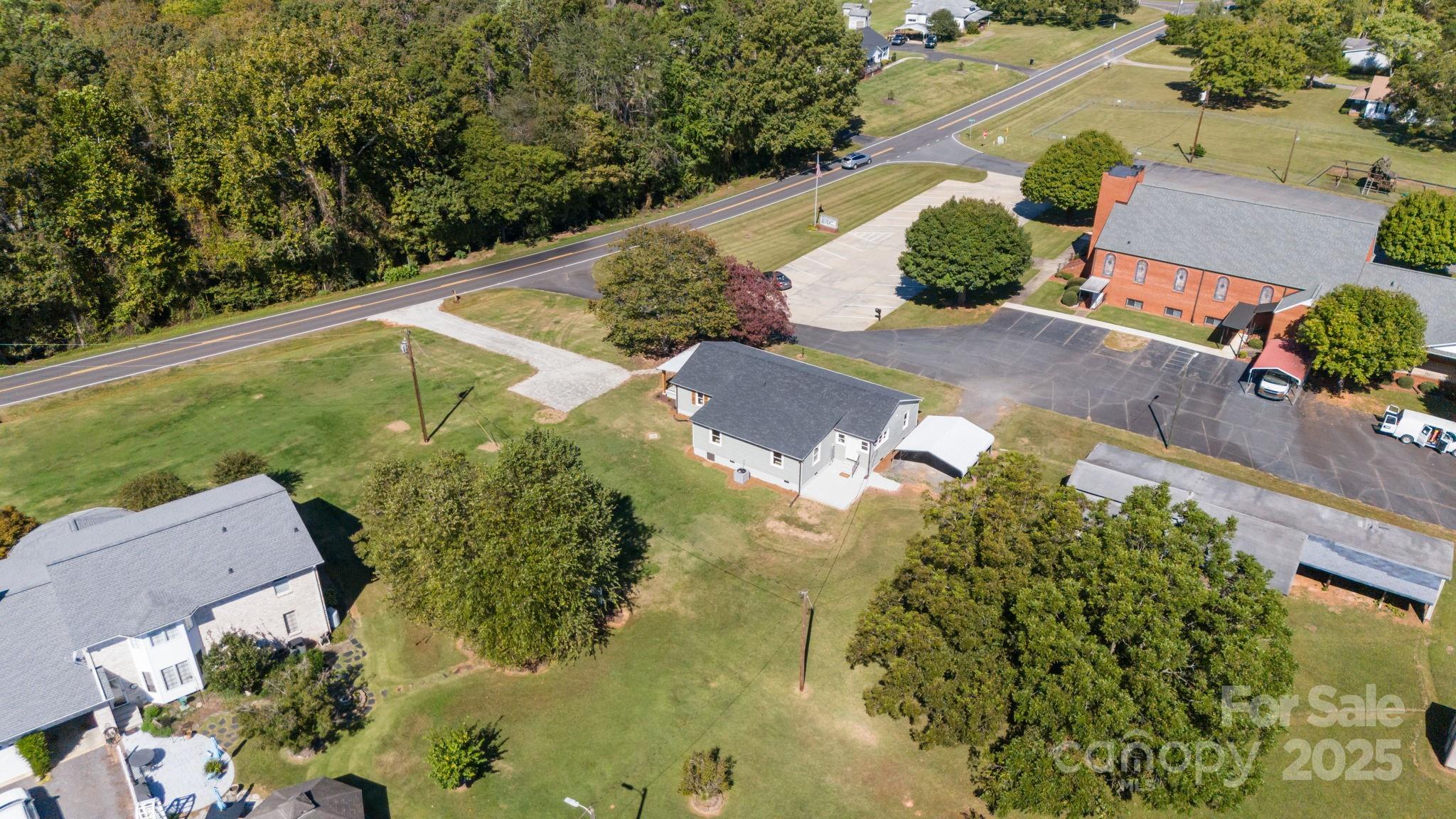 1362 Cornatzer Road Mocksville, NC 27028 - Photo 47 of 48 an aerial view of a house with a yard