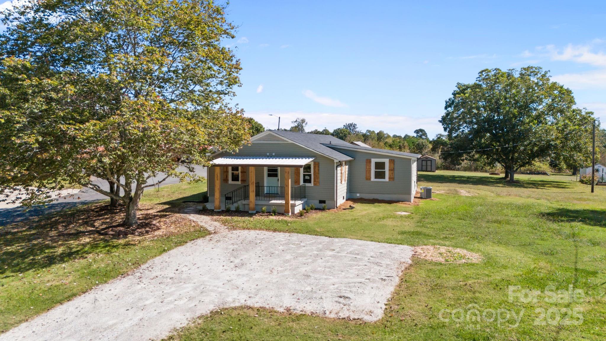 1362 Cornatzer Road Mocksville, NC 27028 - Photo 48 of 48 a front view of a house with a yard