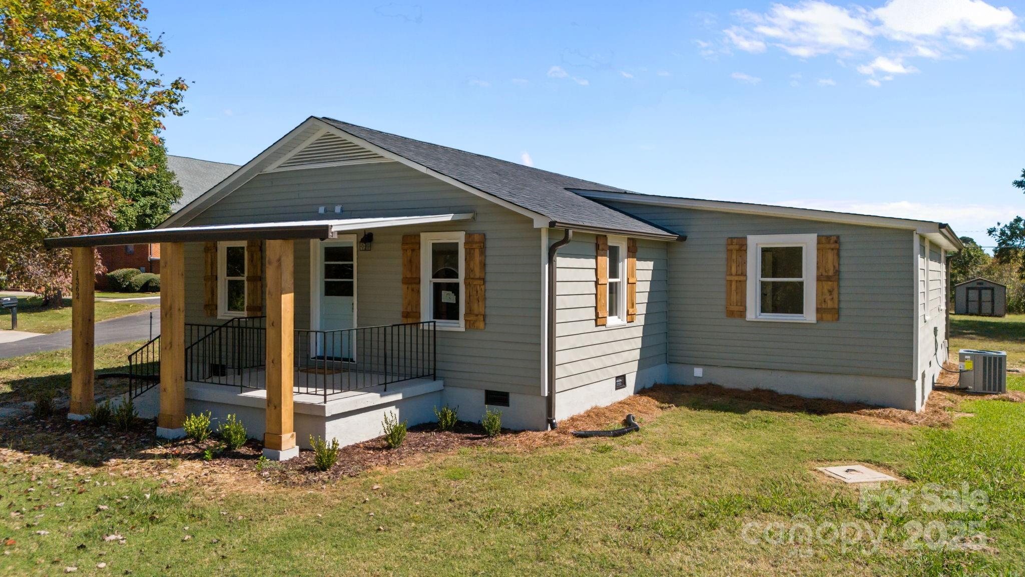 1362 Cornatzer Road Mocksville, NC 27028 - Photo 5 of 48 a front view of a house with a yard