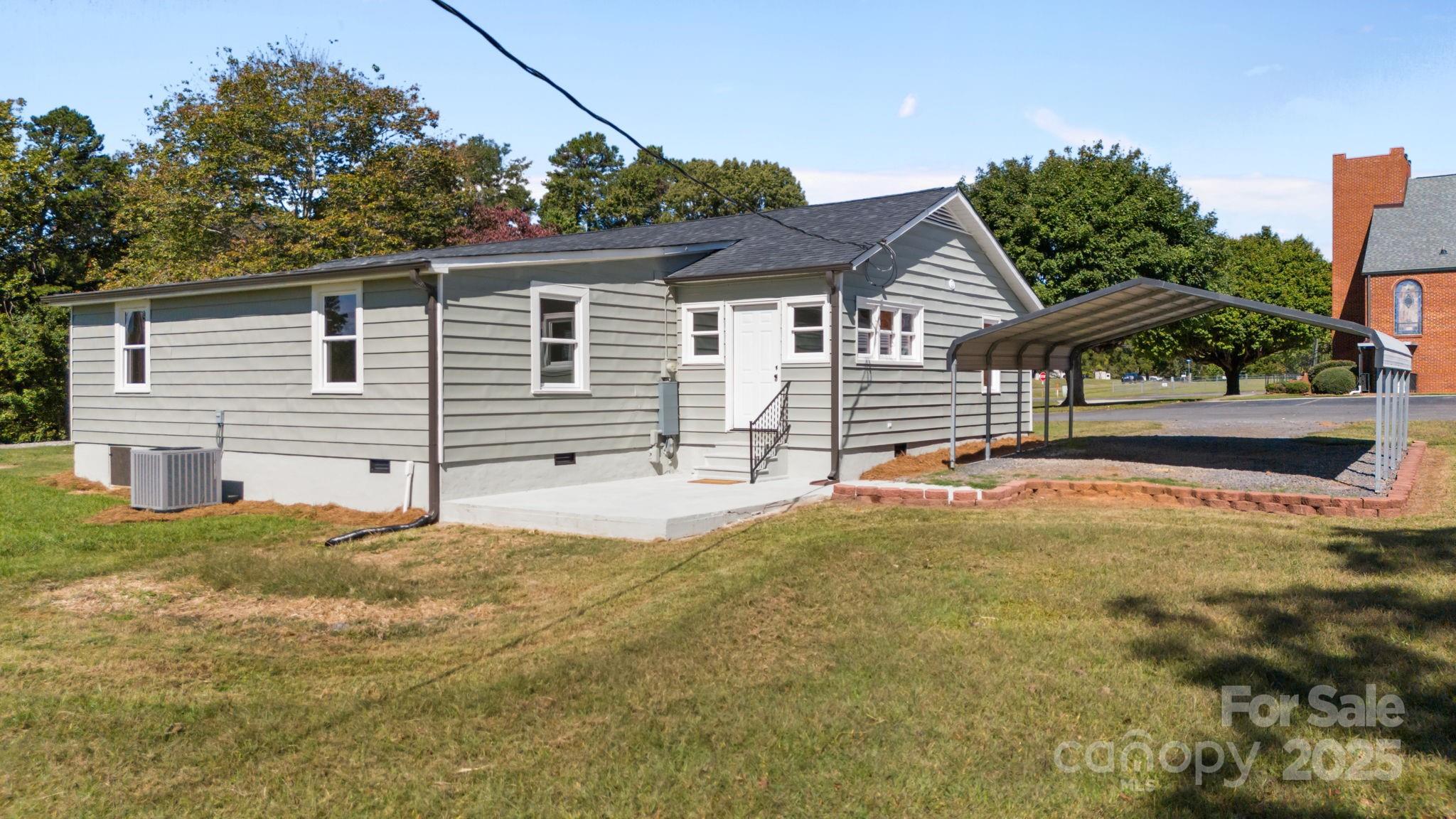 1362 Cornatzer Road Mocksville, NC 27028 - Photo 6 of 48 a front view of a house with a yard