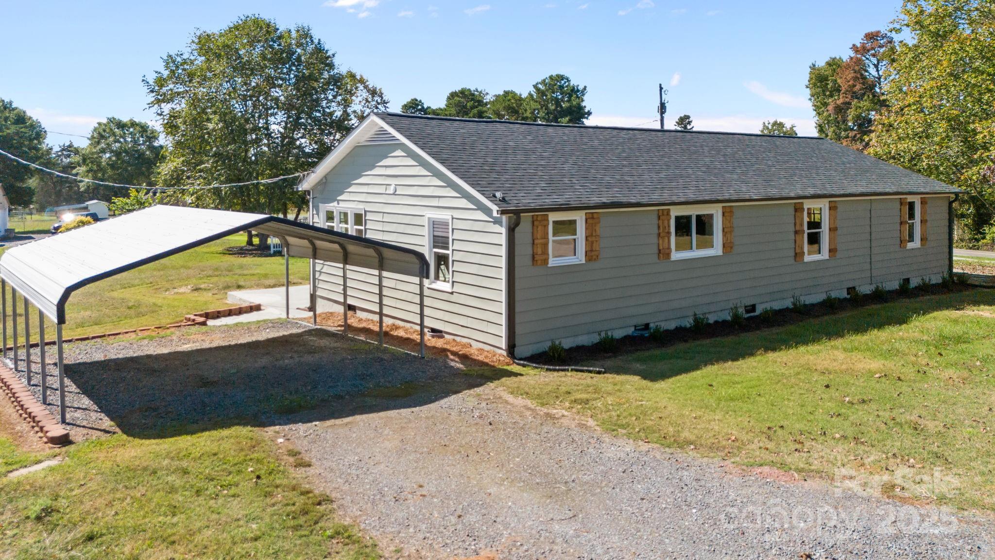 1362 Cornatzer Road Mocksville, NC 27028 - Photo 7 of 48 a view of a house with a yard
