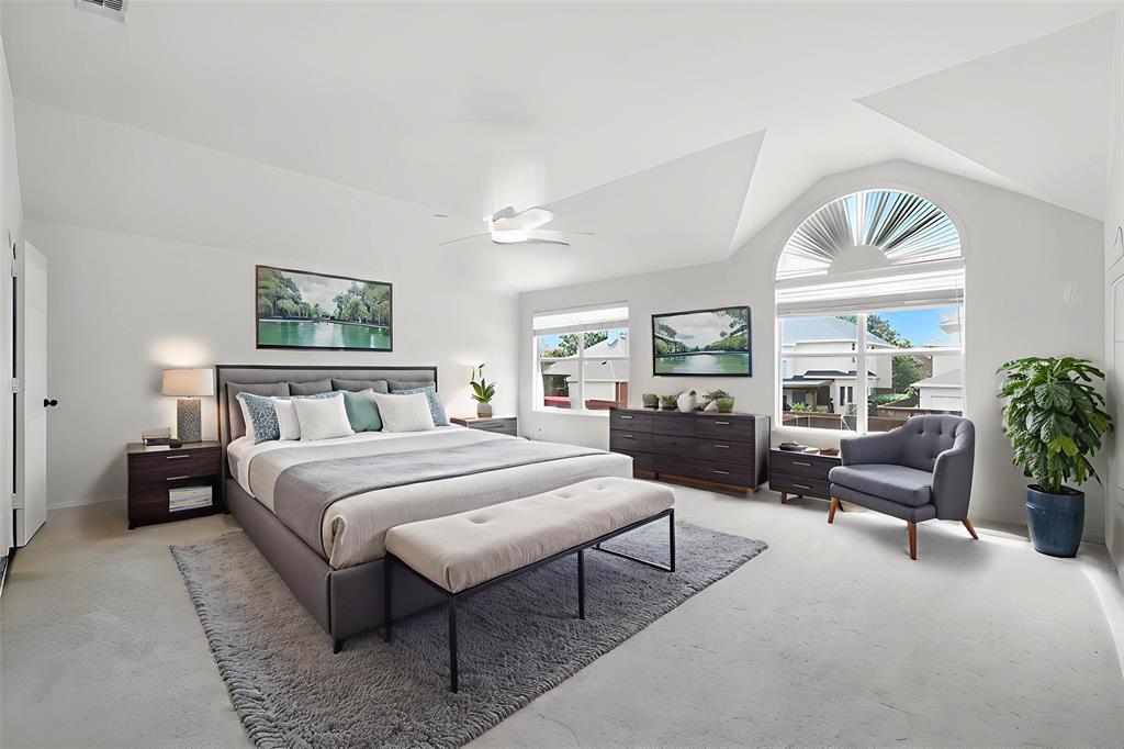 5713 Green Hollow Lane The Colony, TX 75056 - Photo 18 of 29 a bedroom with a large bed and a large window