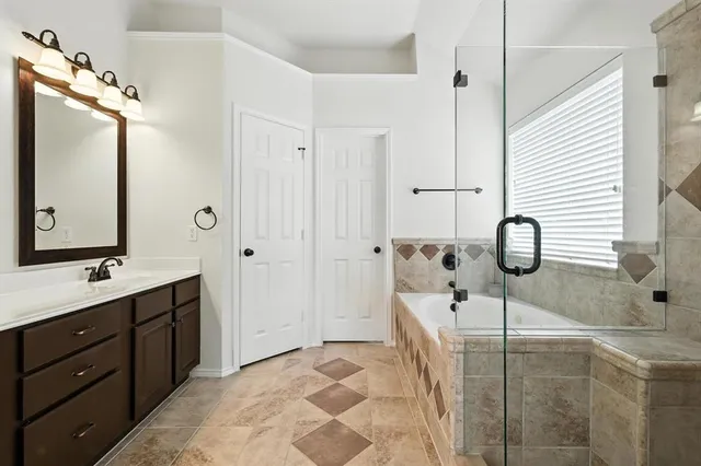 a bathroom with a double vanity sink and mirror
