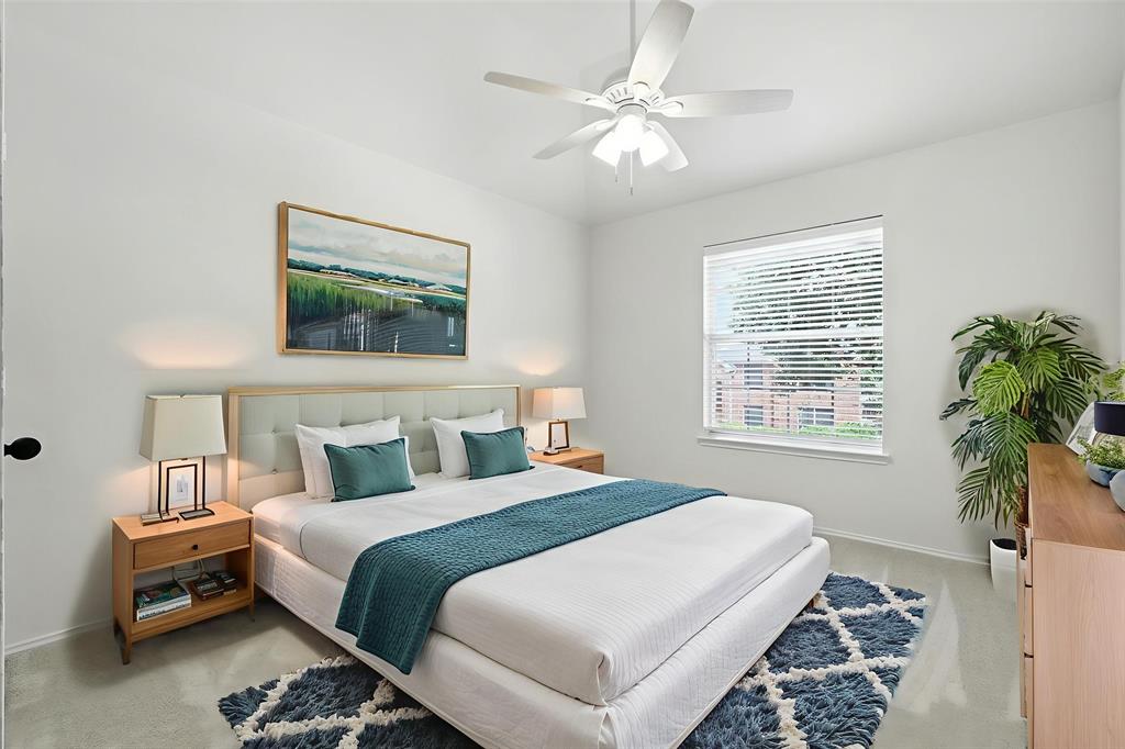 5713 Green Hollow Lane The Colony, TX 75056 - Photo 23 of 29 a bedroom with a bed a couch and a window
