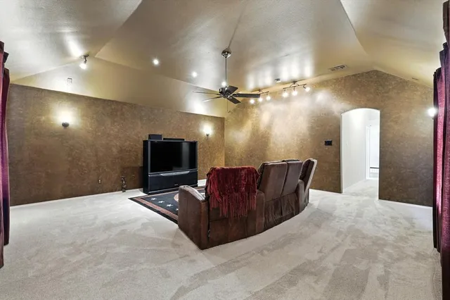 a living room with couch and a flat screen tv