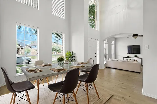 a view of a dining room with furniture and window