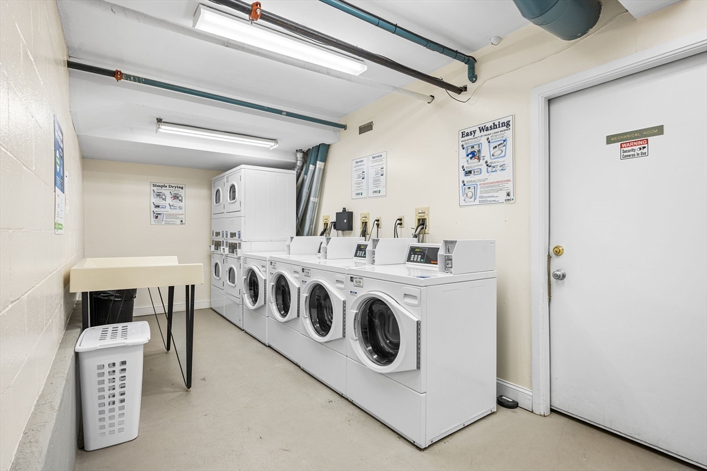 315 Rantoul Street, Unit 402 Beverly, MA 01915 - Photo 16 of 27 a utility room with washer and dryer