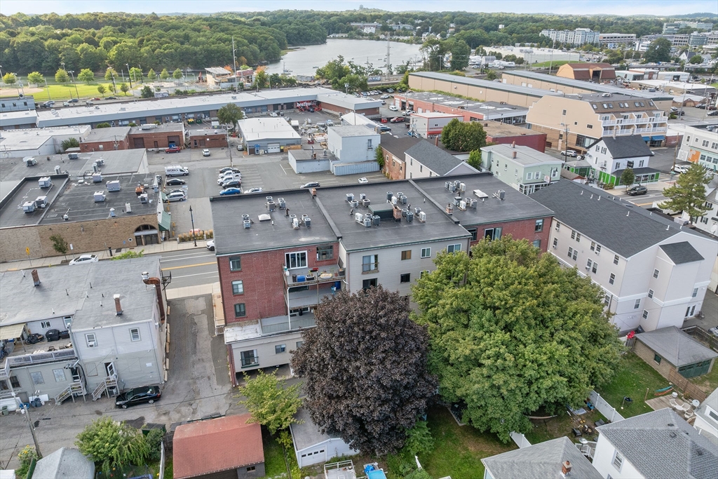 315 Rantoul Street, Unit 402 Beverly, MA 01915 - Photo 27 of 27 an aerial view of a house with a garden
