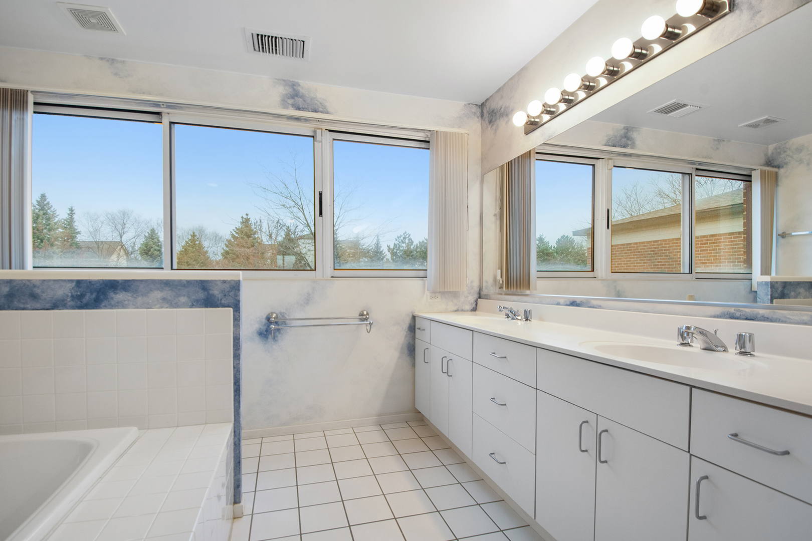 507 Kelburn Road Deerfield, IL 60015 - Photo 13 of 26 a bathroom with a sink mirror and a large window
