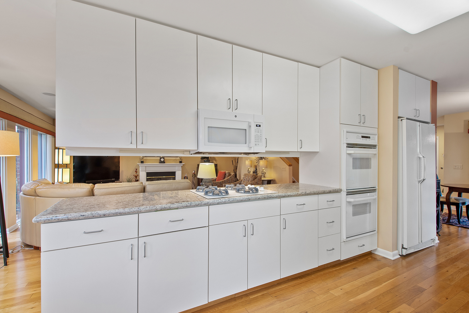 507 Kelburn Road Deerfield, IL 60015 - Photo 4 of 26 a kitchen with stainless steel appliances granite countertop white cabinets and sink